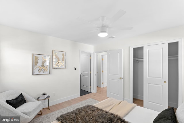 bedroom featuring hardwood / wood-style flooring, a closet, and ceiling fan