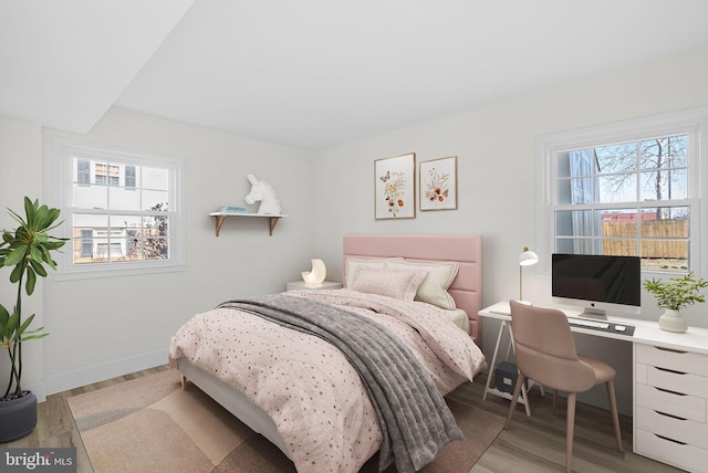 bedroom with light hardwood / wood-style floors