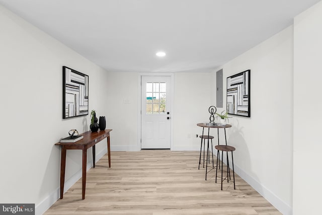 entryway featuring electric panel and light hardwood / wood-style flooring