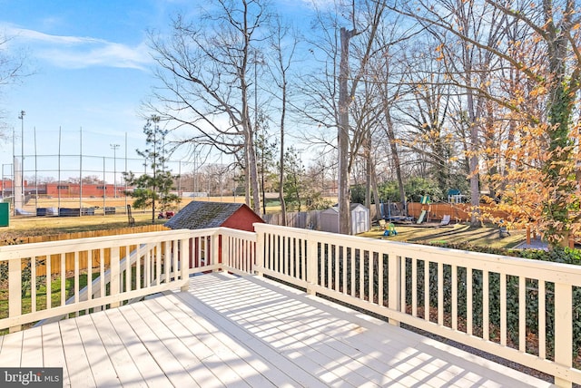 wooden terrace featuring a shed