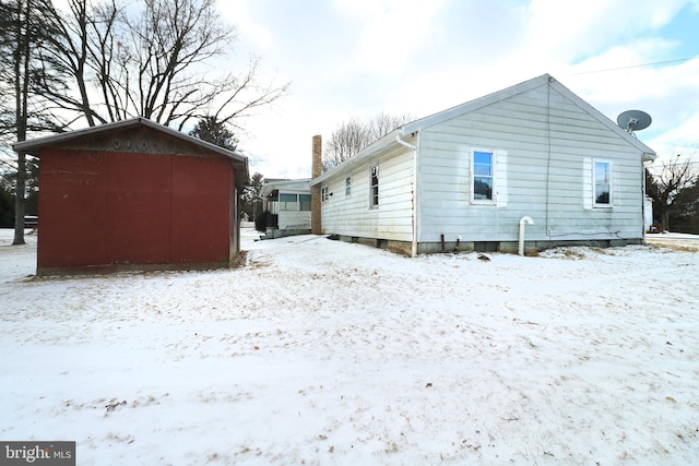 view of snow covered house