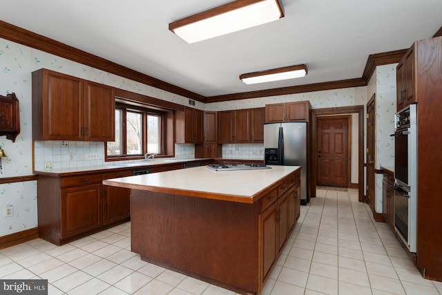 kitchen with wallpapered walls, a center island, stainless steel fridge with ice dispenser, light countertops, and white gas stovetop