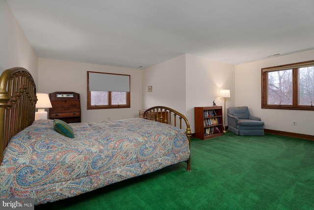 bedroom with multiple windows, baseboards, and carpet floors