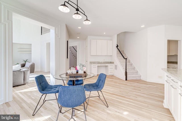 dining space with visible vents, stairway, light wood-style flooring, and recessed lighting