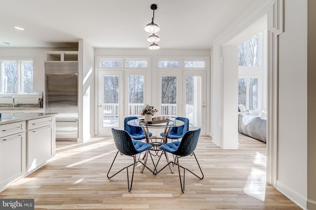 dining space with light wood-style floors