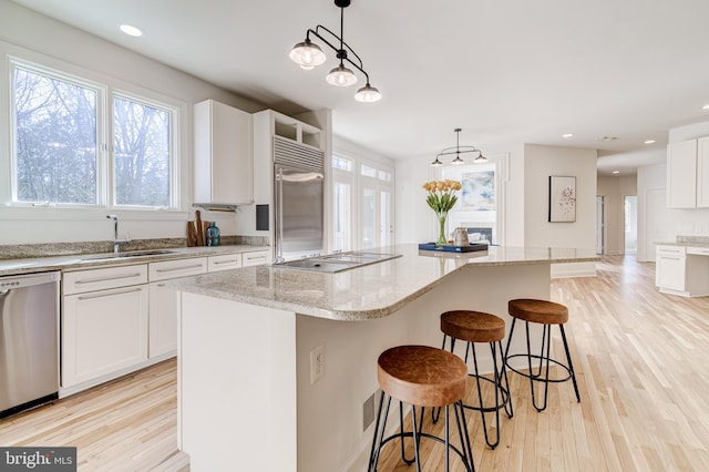 kitchen featuring a center island and decorative light fixtures