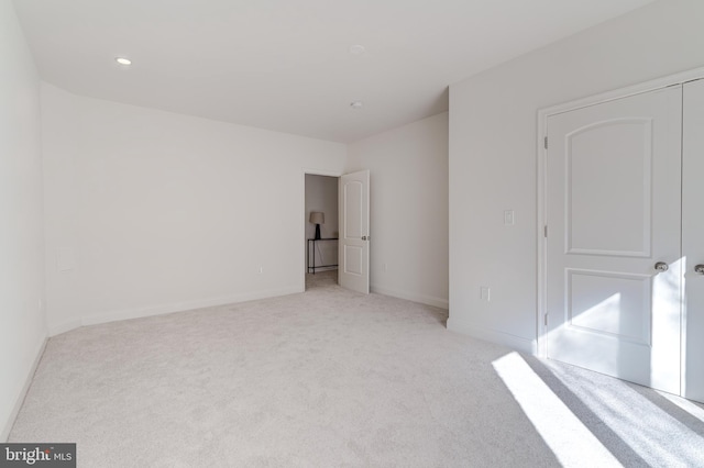 bedroom featuring baseboards, recessed lighting, and light colored carpet