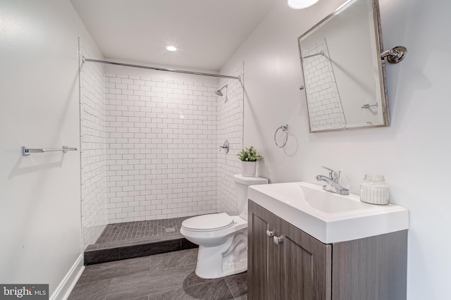 full bathroom with toilet, a shower stall, and vanity