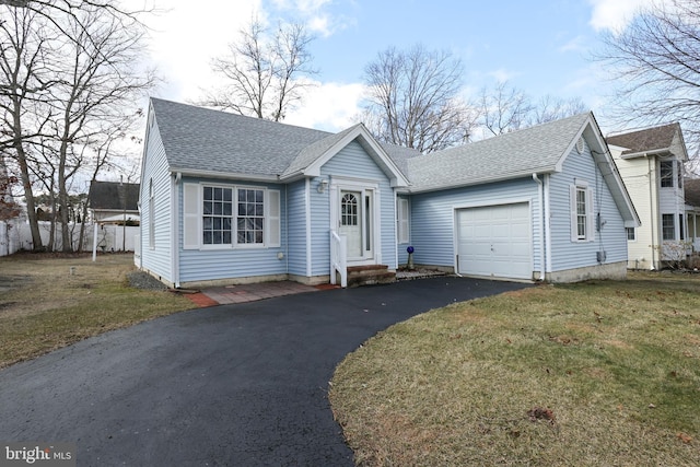 view of front of house featuring a garage and a front yard