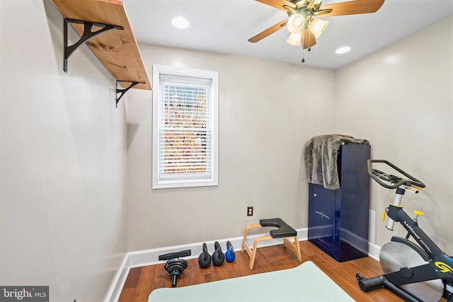 workout room with ceiling fan and hardwood / wood-style floors