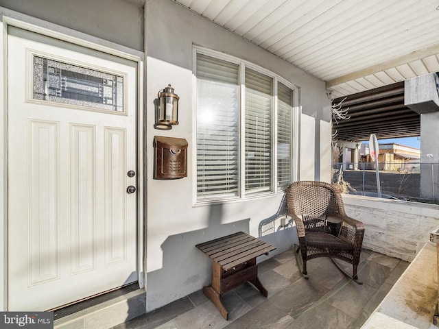 property entrance with a porch