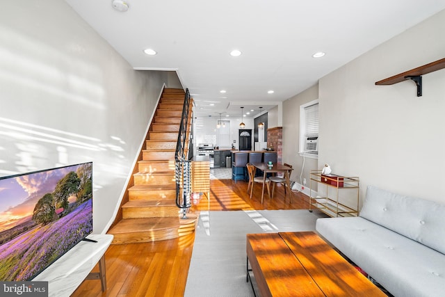 living room with light hardwood / wood-style flooring