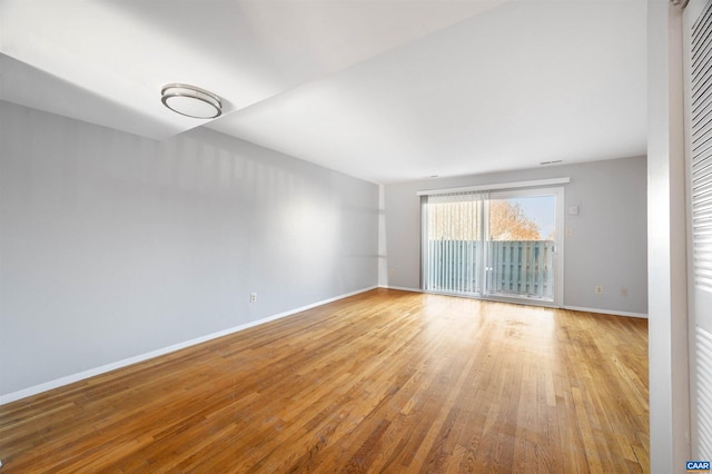 spare room featuring light hardwood / wood-style floors