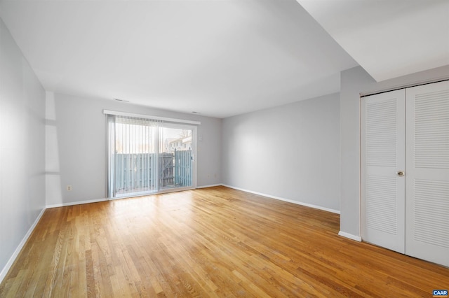 interior space with a closet, light hardwood / wood-style flooring, and access to outside