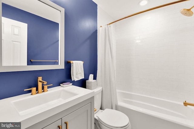 bathroom featuring shower / bath combo, vanity, and toilet