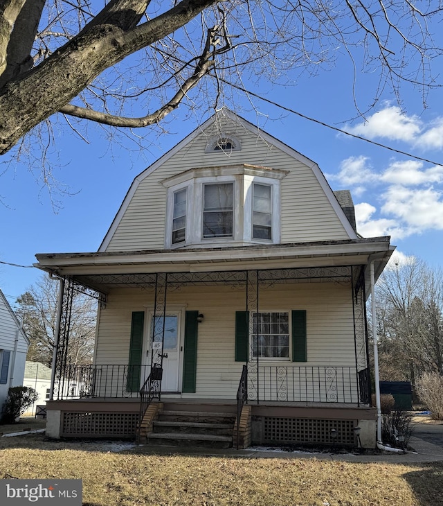 view of front of property featuring covered porch