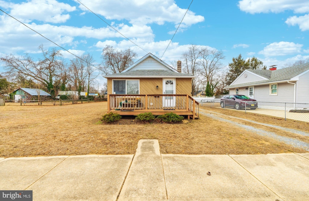 bungalow-style home with a deck