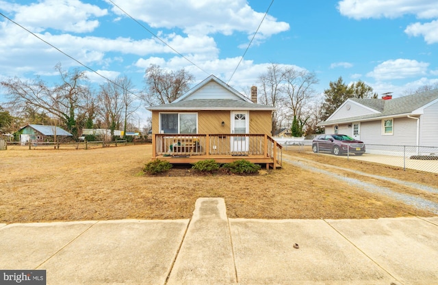 bungalow-style home with a deck