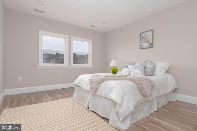 bedroom with light hardwood / wood-style floors