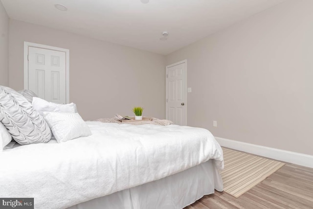 bedroom with hardwood / wood-style floors