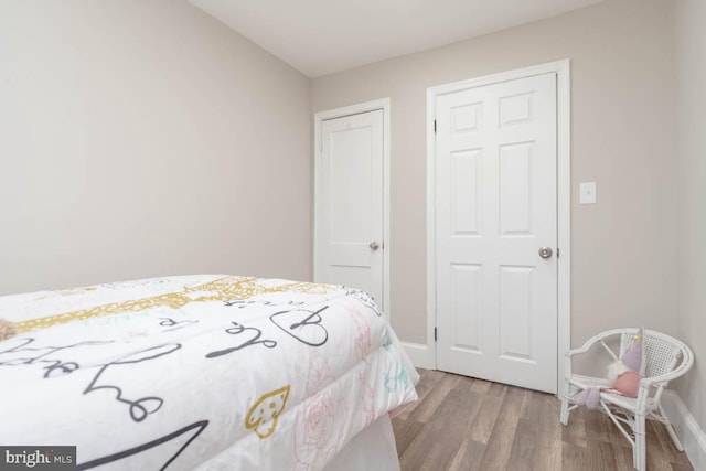 bedroom with light hardwood / wood-style floors