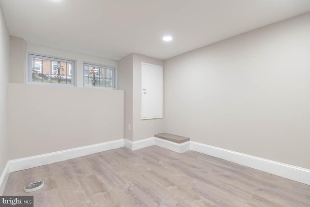 unfurnished room with light hardwood / wood-style floors