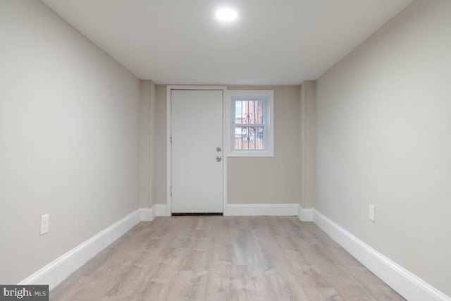 spare room with light hardwood / wood-style flooring