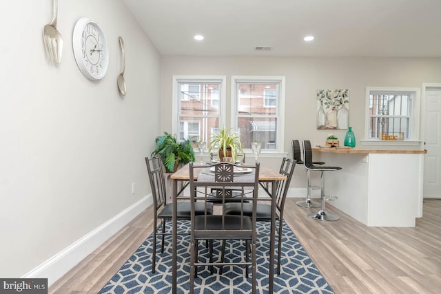 dining space featuring hardwood / wood-style floors