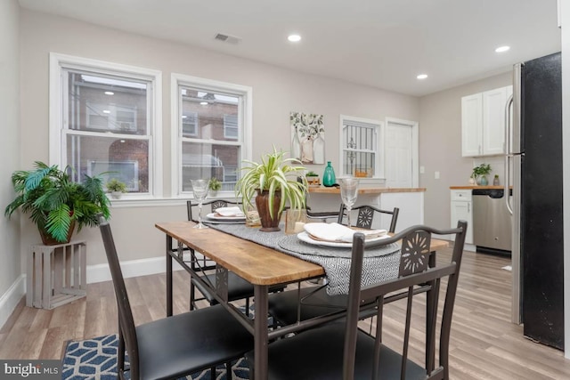 dining room featuring light hardwood / wood-style floors