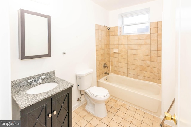 full bathroom with vanity, toilet, tiled shower / bath combo, and tile patterned flooring