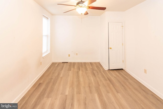 empty room featuring ceiling fan and light hardwood / wood-style floors