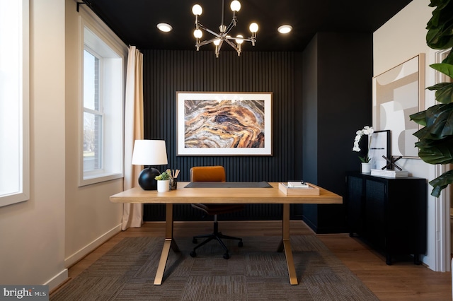 office featuring hardwood / wood-style flooring and a notable chandelier