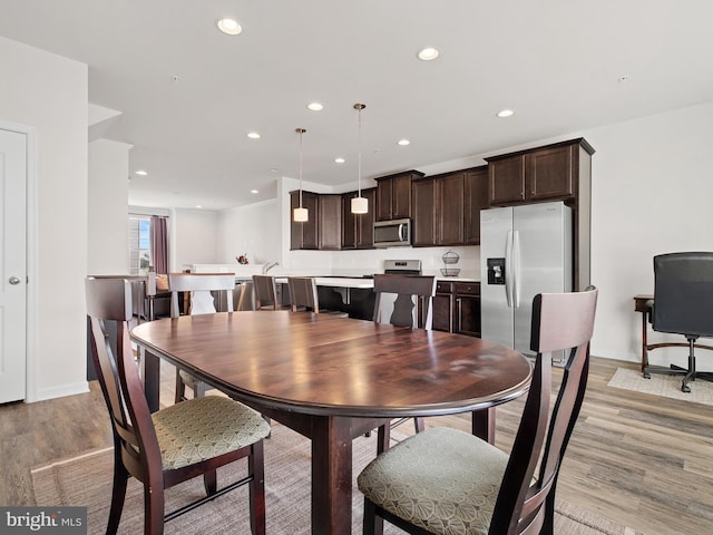 dining room with light hardwood / wood-style flooring