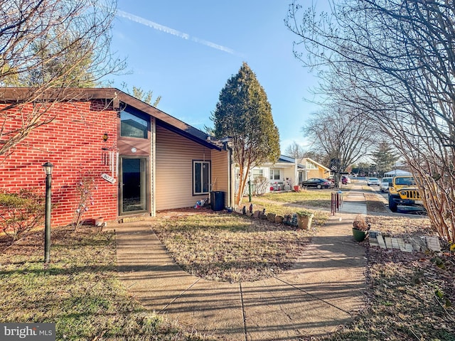 6073 Wycoff Sq, Centreville, VA 20120 - view of property exterior featuring a lawn