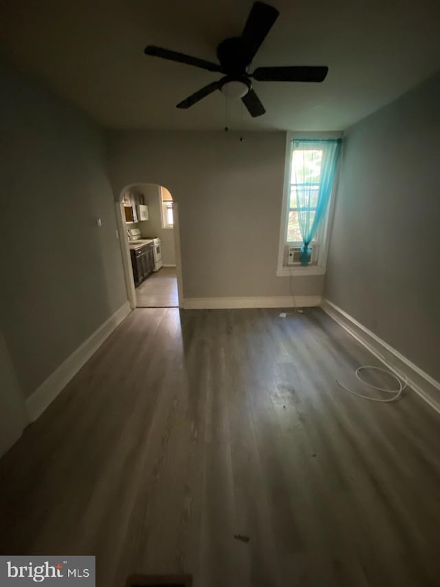 spare room featuring hardwood / wood-style floors and ceiling fan