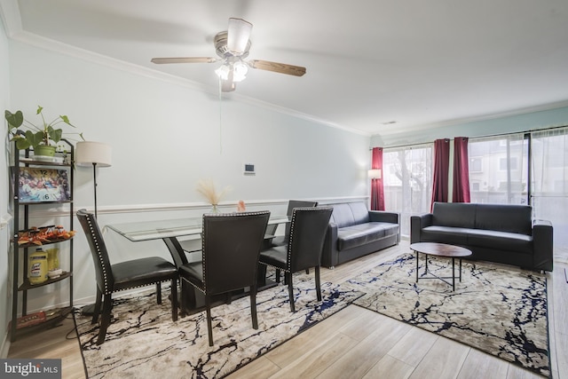 living room with crown molding and wood-type flooring