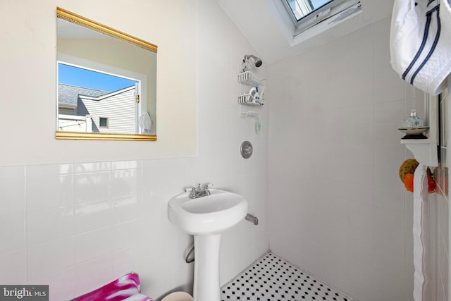 125 Peter Rd, Manahawkin, NJ 08050 - full bathroom featuring a skylight, tile walls, and a tile shower
