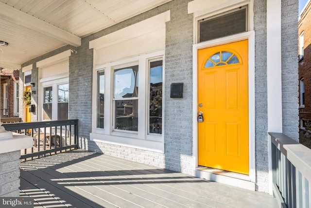 doorway to property with a porch