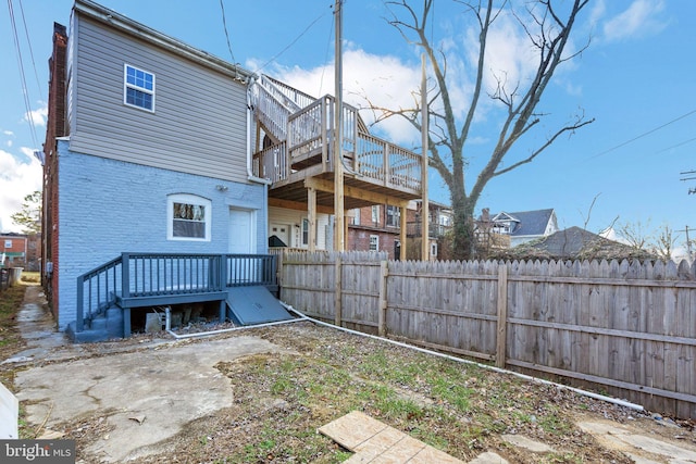 back of house featuring a deck