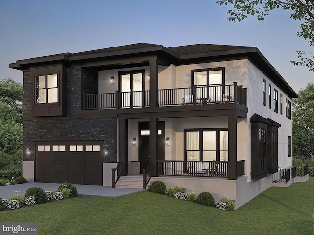 view of front facade with a garage, a lawn, a balcony, and stucco siding