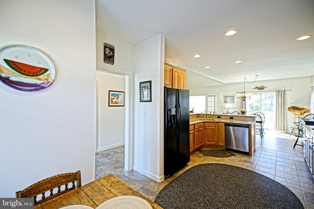 kitchen with dishwasher, a peninsula, recessed lighting, and black fridge with ice dispenser