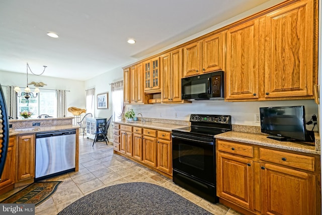 kitchen with black appliances, glass insert cabinets, recessed lighting, and brown cabinets