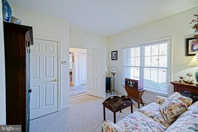 bedroom featuring vaulted ceiling, carpet flooring, and baseboards