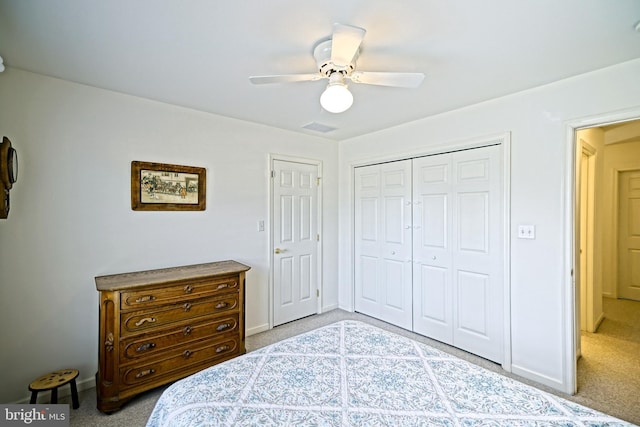 bedroom with a closet, baseboards, carpet, and ceiling fan