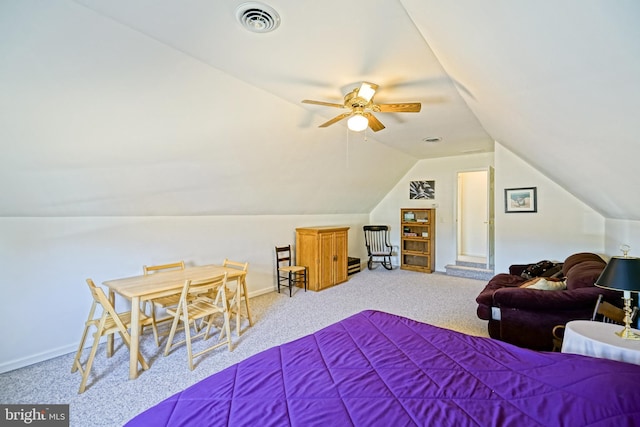 bedroom featuring lofted ceiling, carpet flooring, baseboards, and visible vents