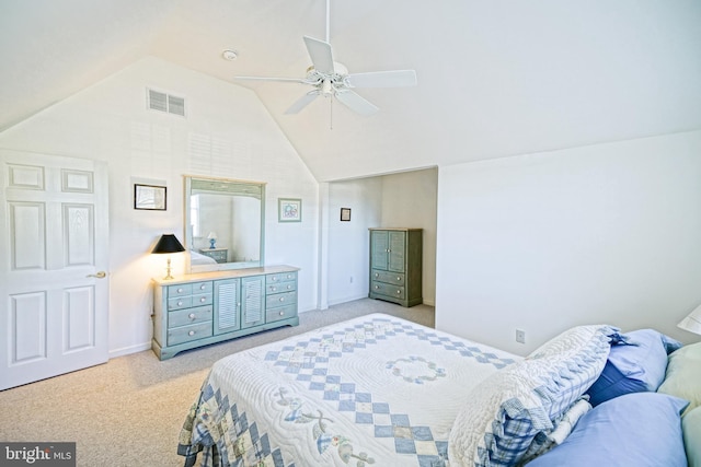 bedroom with visible vents, light colored carpet, a ceiling fan, and lofted ceiling