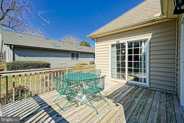 wooden deck with outdoor dining area