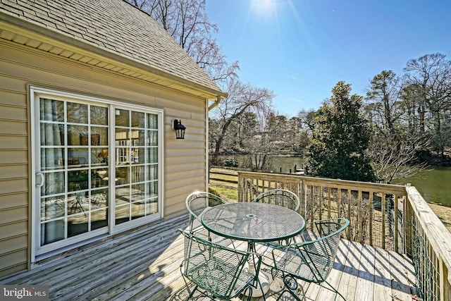 wooden terrace featuring outdoor dining space