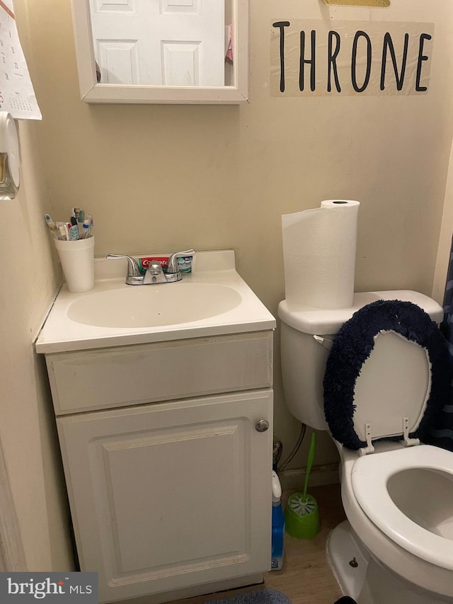 bathroom featuring vanity and toilet