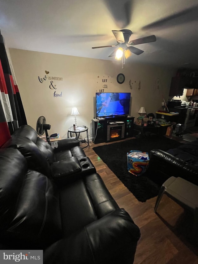 living room with hardwood / wood-style flooring and ceiling fan